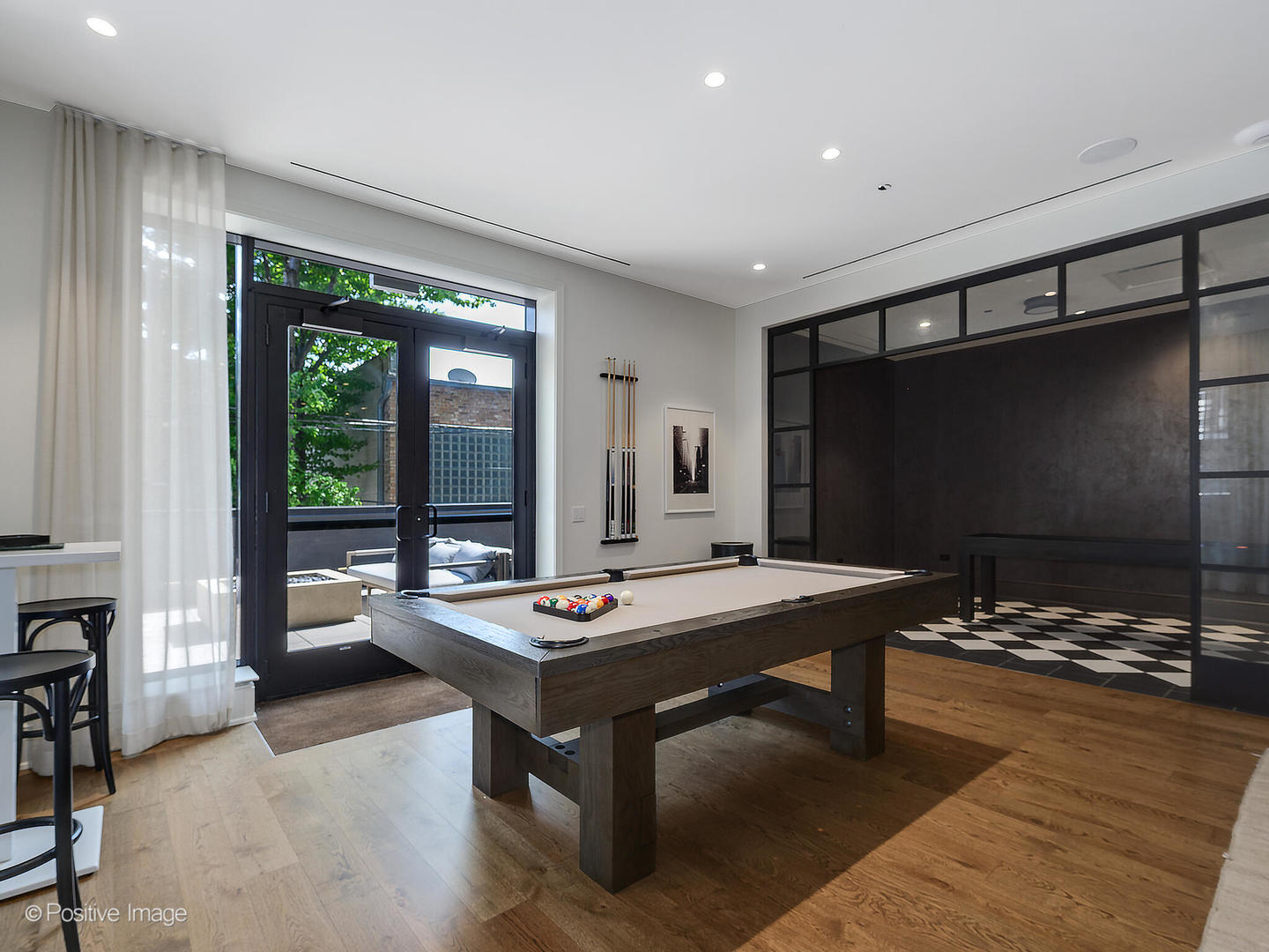 21 North May Street, Unit 305 Chicago, IL 60607 - Photo 33 of 38 a room with furniture pool table and flat screen tv