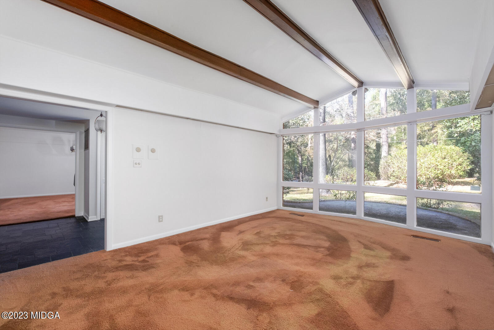 1460 Lone Oak Road Macon, GA 31211 - Photo 11 of 34 a view of an empty room with wooden floor and a window
