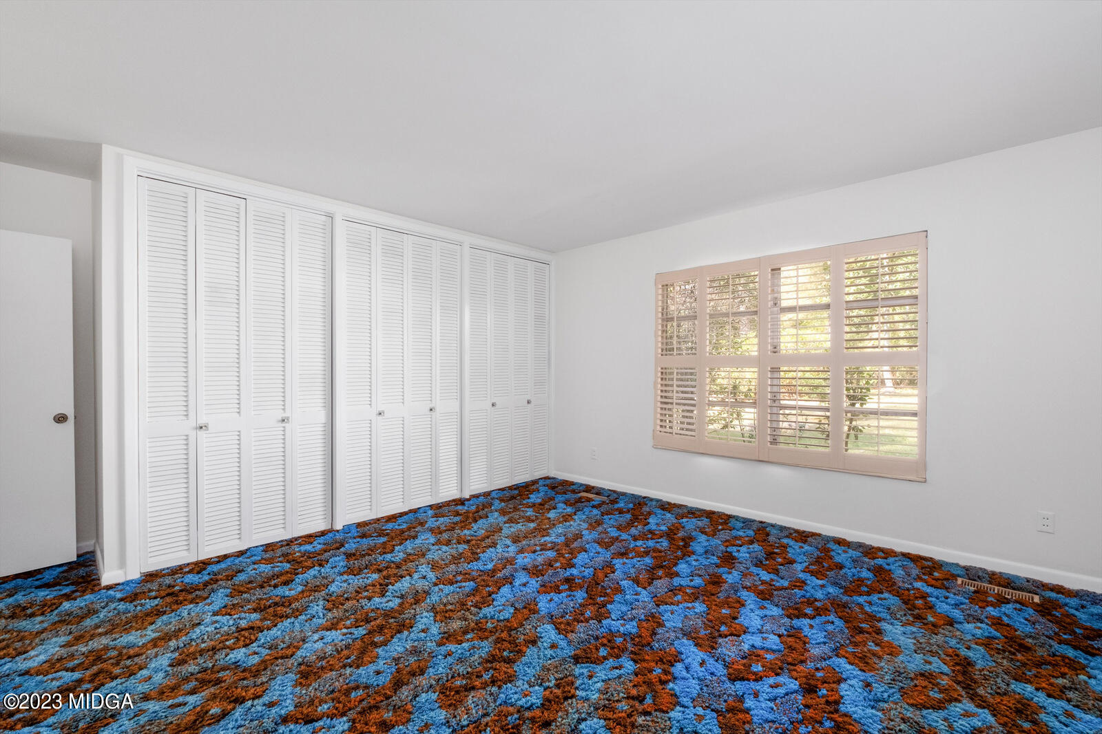 1460 Lone Oak Road Macon, GA 31211 - Photo 16 of 34 a bedroom with a bed and a window