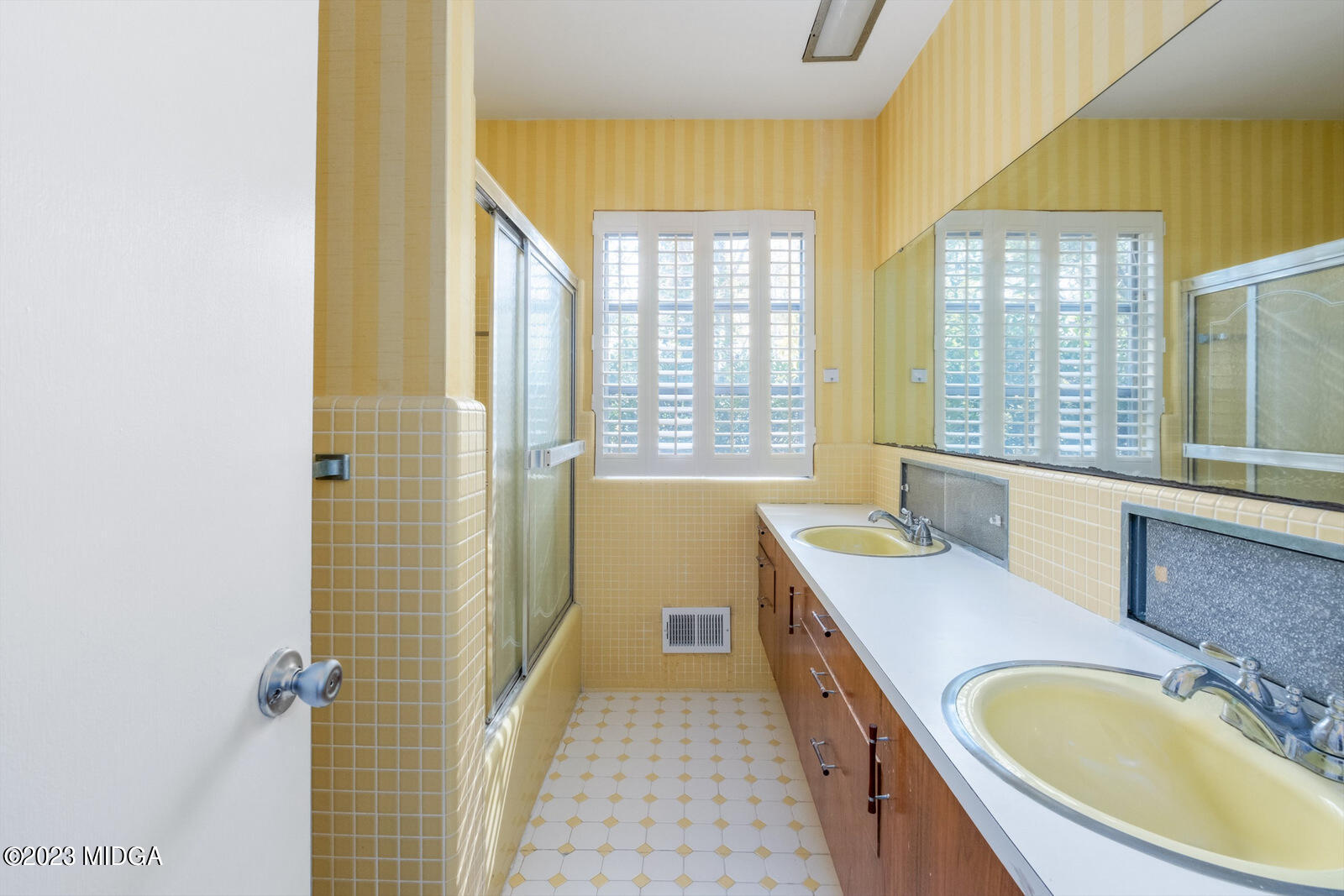 1460 Lone Oak Road Macon, GA 31211 - Photo 20 of 34 a bathroom with a granite countertop tub sink a mirror and a shower