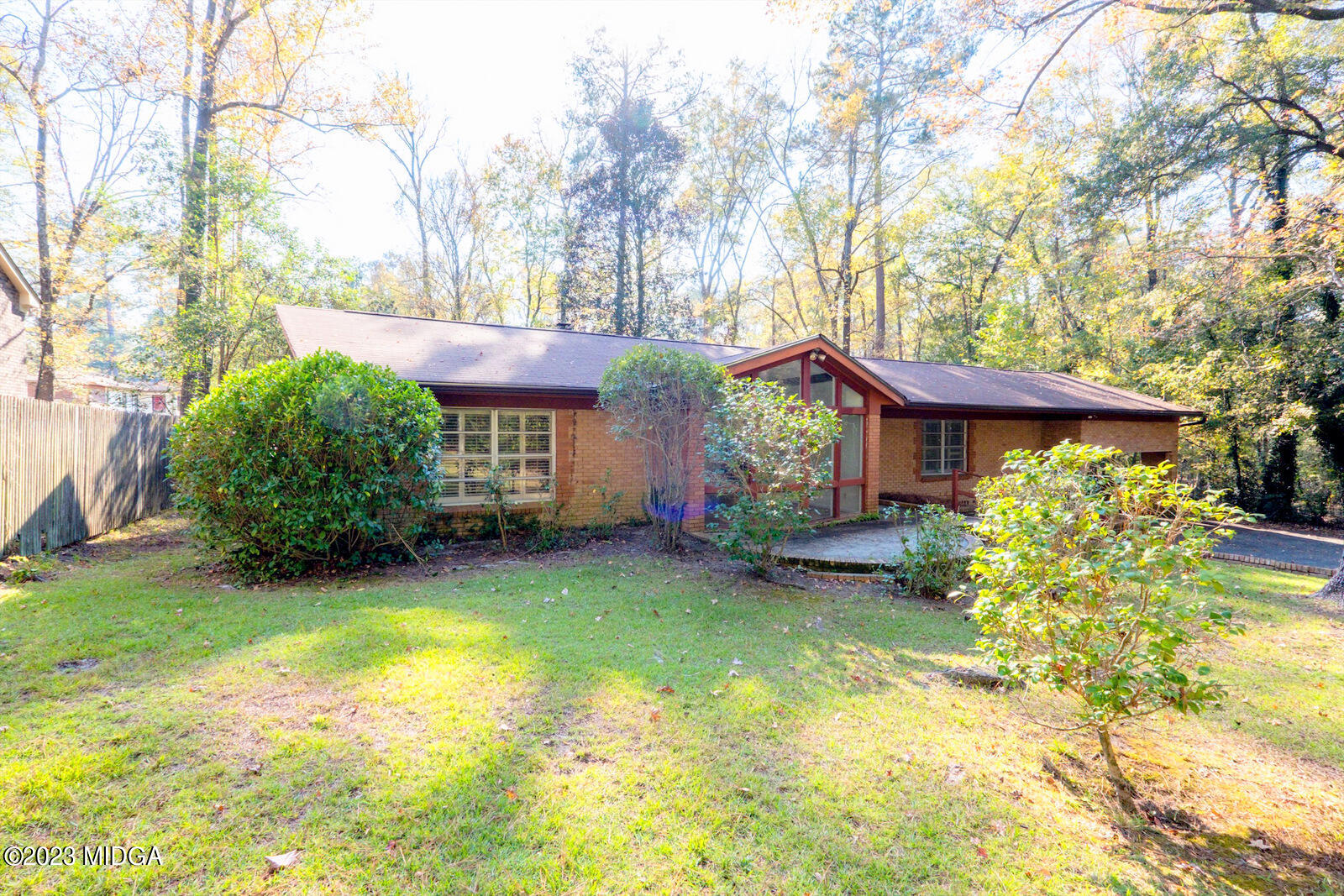 1460 Lone Oak Road Macon, GA 31211 - Photo 29 of 34 a view of a house with a large tree and a yard