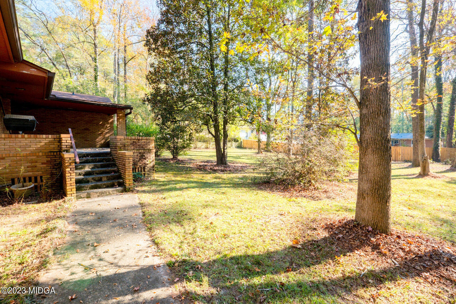 1460 Lone Oak Road Macon, GA 31211 - Photo 31 of 34 a view of a backyard with large trees