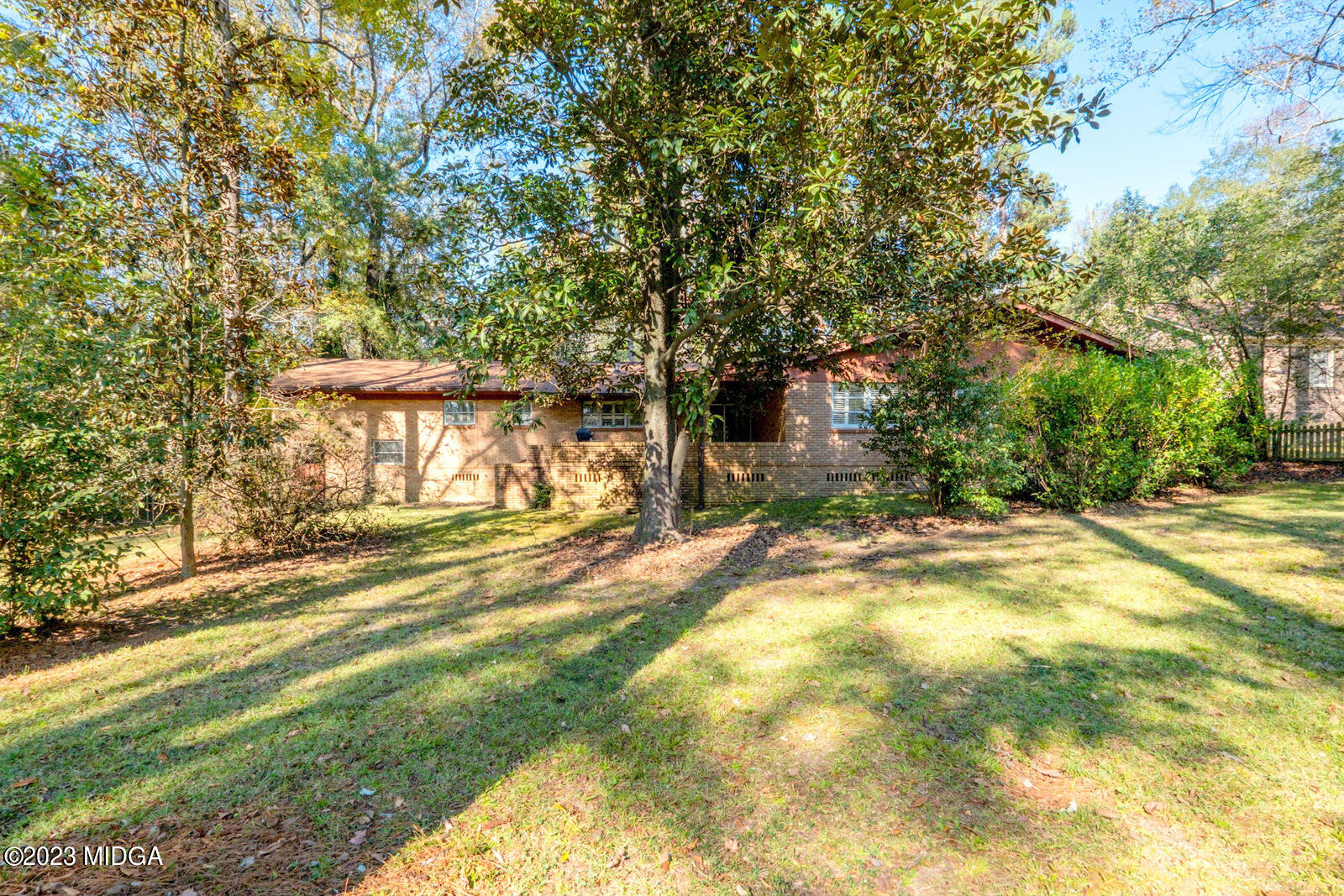 1460 Lone Oak Road Macon, GA 31211 - Photo 33 of 34 a view of a house with a yard and garage