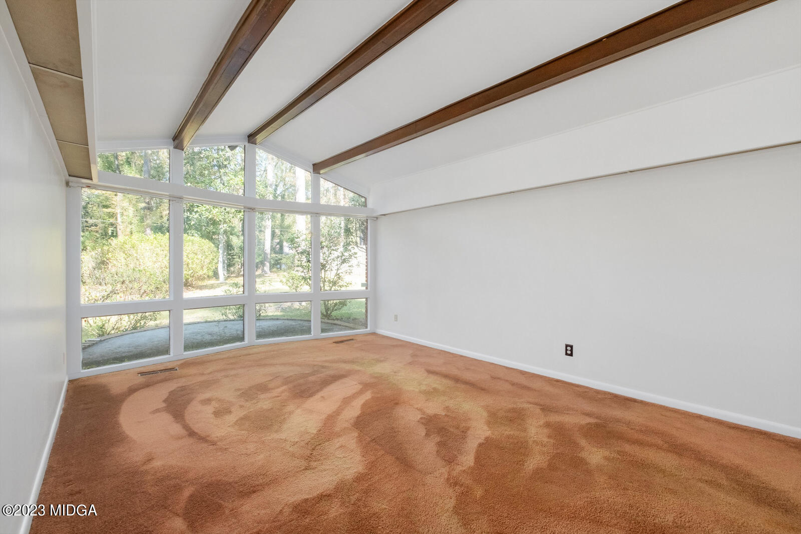 1460 Lone Oak Road Macon, GA 31211 - Photo 9 of 34 a bed sitting in a bedroom next to a large window