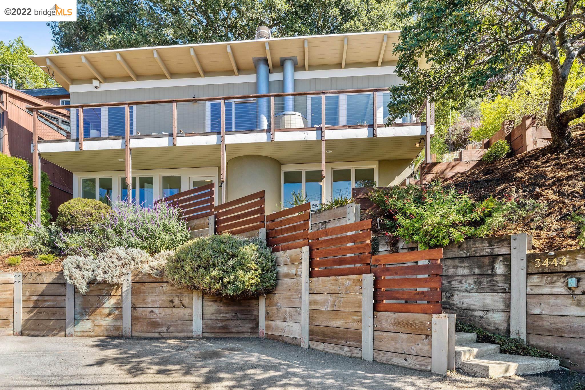 3444 Dwight Way Berkeley, CA 94704 - Photo 1 of 1 a front view of a house with garden