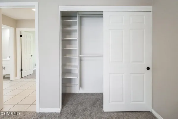 a view of a closet area with empty racks