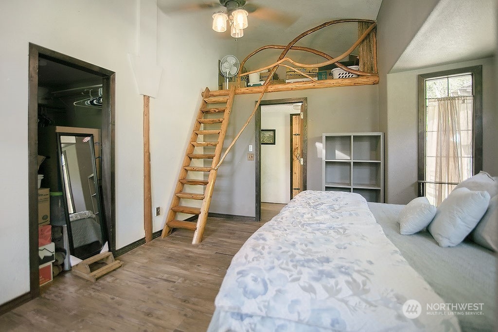 2038 Abernathy Creek Road Longview, WA 98632 - Photo 20 of 37 a view of a bedroom with furniture and staircase