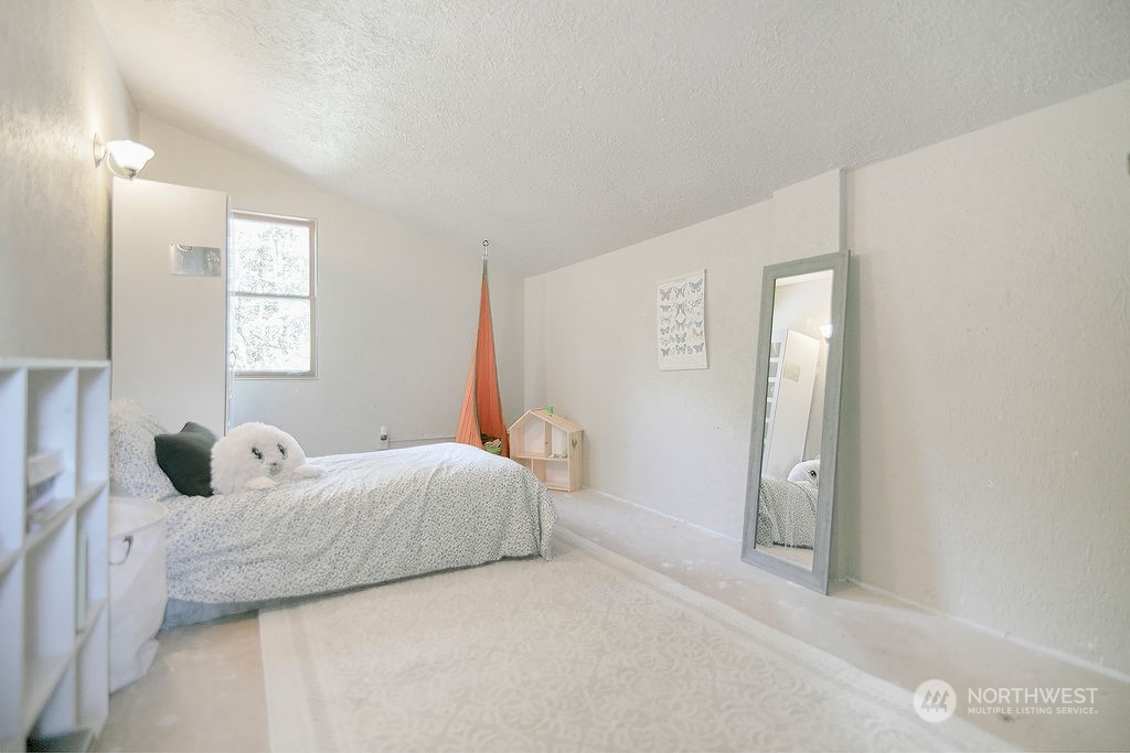 2038 Abernathy Creek Road Longview, WA 98632 - Photo 21 of 37 a bedroom with a bed and a window