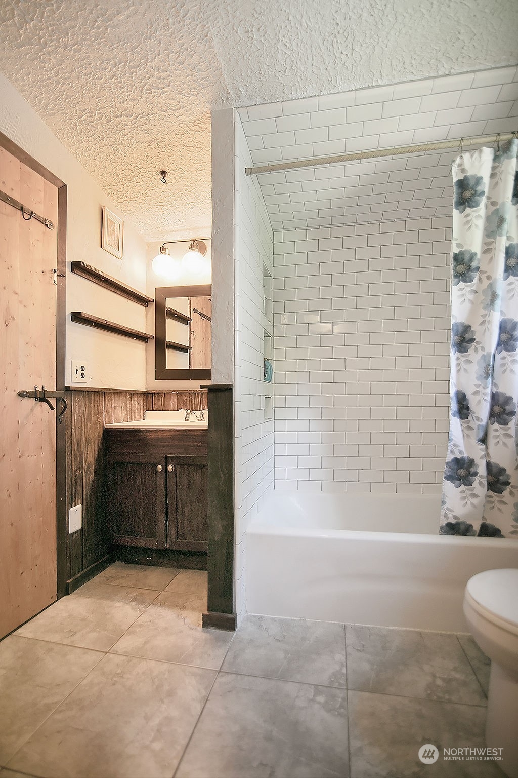 2038 Abernathy Creek Road Longview, WA 98632 - Photo 24 of 37 a bathroom with a granite countertop sink a toilet and shower