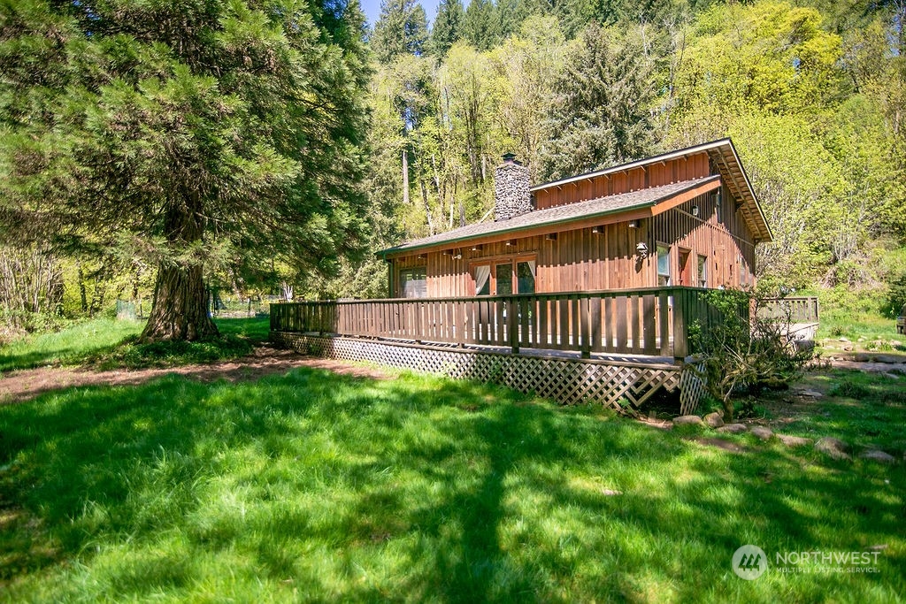 2038 Abernathy Creek Road Longview, WA 98632 - Photo 36 of 37 a view of backyard with deck and garden