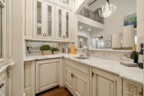 a kitchen with a sink and cabinets