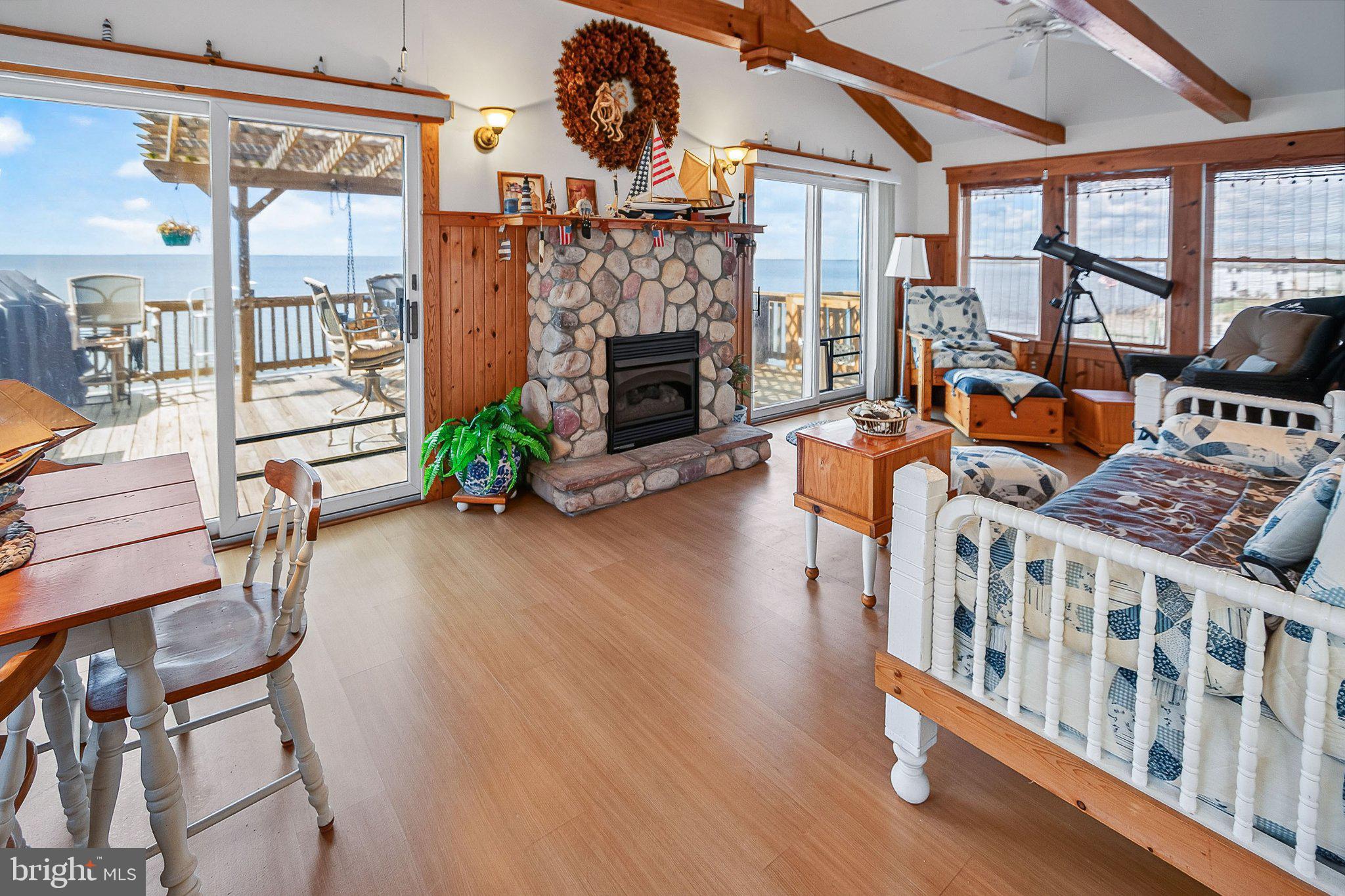 314 New Jersey Avenue Fortescue, NJ 08321 - Photo 16 of 38 Upper level family room w/ stone gas fireplace