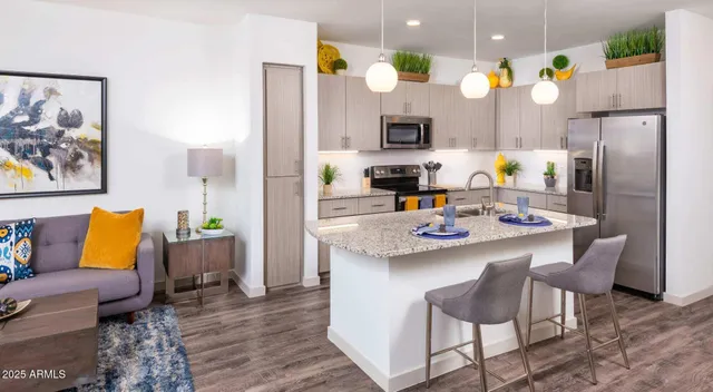 a kitchen with a sink cabinets and refrigerator