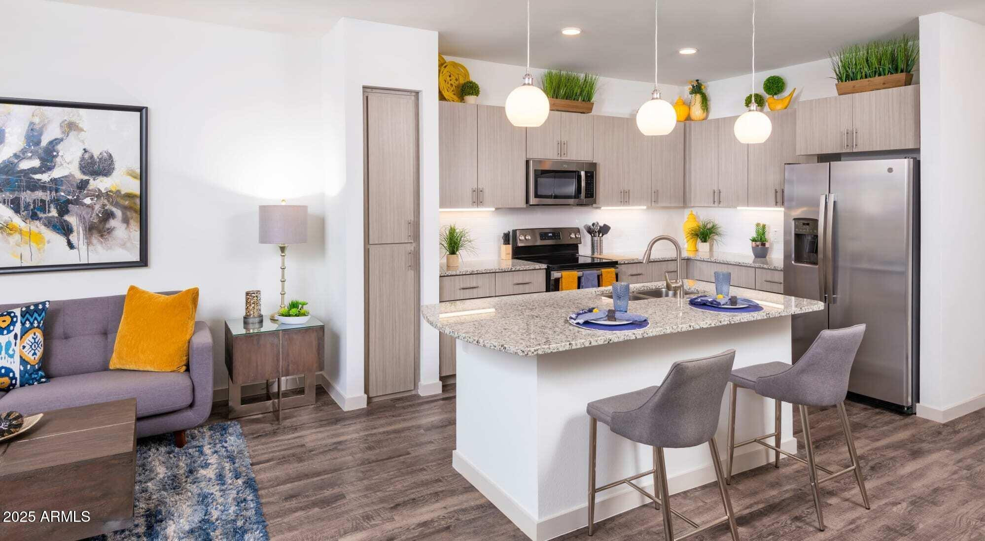 3700 East Williams Field Road, Unit 3 Gilbert, AZ 85295 - Photo 3 of 19 a kitchen with a sink cabinets and refrigerator