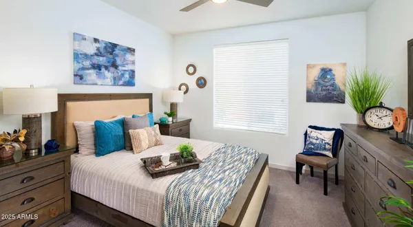 a bedroom with a bed and a table in it
