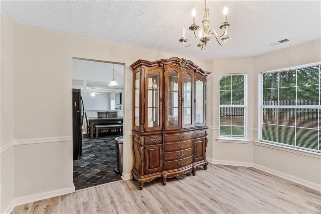 675 Michael Circle Monroe, GA 30655 - Photo 11 of 34 a view of a bedroom with furniture window and wooden floor