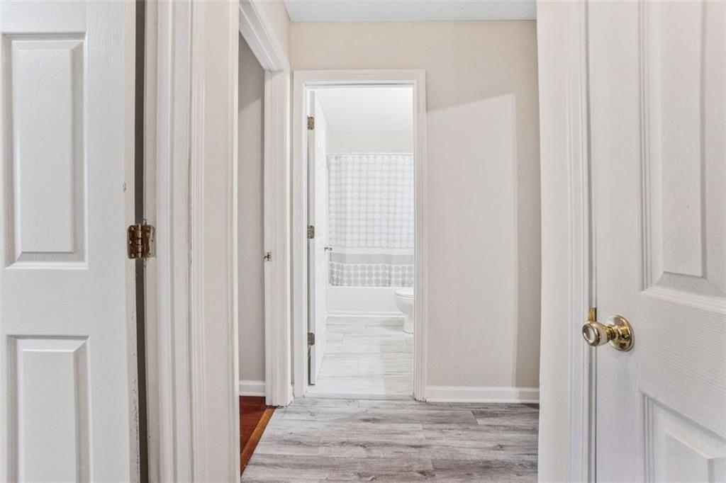 675 Michael Circle Monroe, GA 30655 - Photo 22 of 34 a view of a hallway with wooden floor