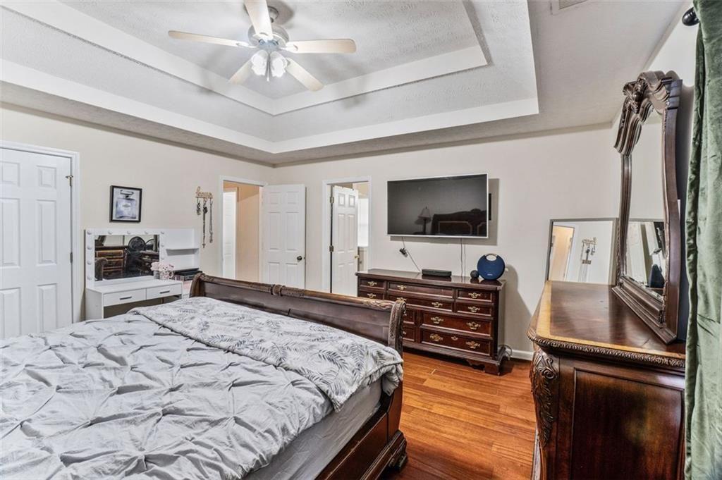 675 Michael Circle Monroe, GA 30655 - Photo 28 of 34 a bedroom with a bed and a flat screen tv