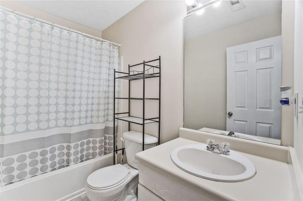 675 Michael Circle Monroe, GA 30655 - Photo 30 of 34 a bathroom with a sink toilet and shower