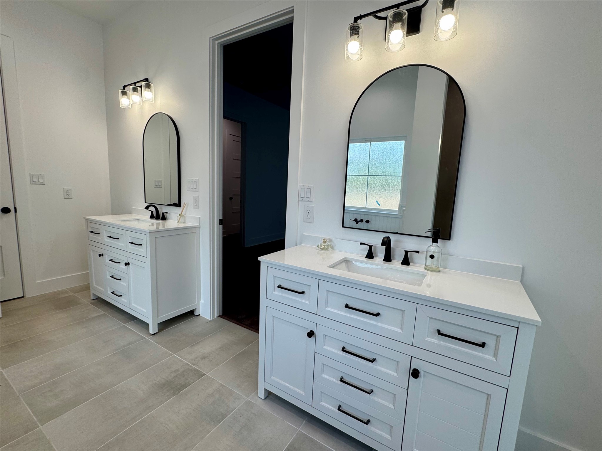 1353 Red Town Road, Unit B Elgin, TX 78621 - Photo 15 of 26 a bathroom with a double vanity sink and mirror