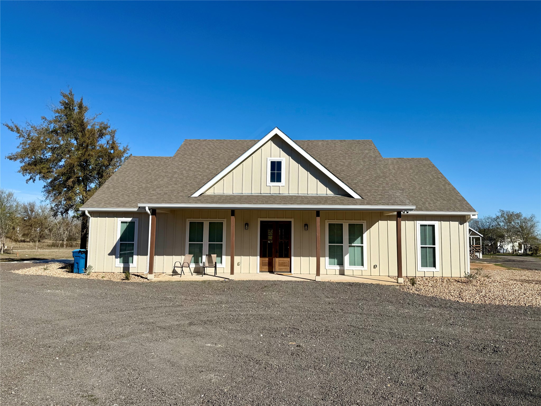 1353 Red Town Road, Unit B Elgin, TX 78621 - Photo 2 of 26 a front view of a house with a yard