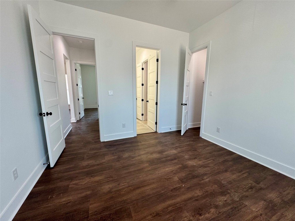 1353 Red Town Road, Unit B Elgin, TX 78621 - Photo 24 of 26 a view of a hallway with wooden floor and staircase