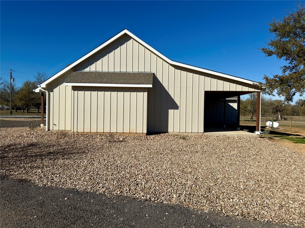 1353 Red Town Road, Unit B Elgin, TX 78621 - Photo 3 of 26 a front view of a house with a yard