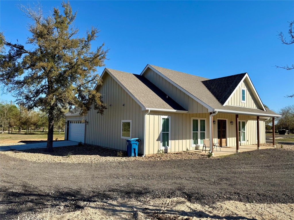 1353 Red Town Road, Unit B Elgin, TX 78621 - Photo 4 of 26 a front view of a house with a yard