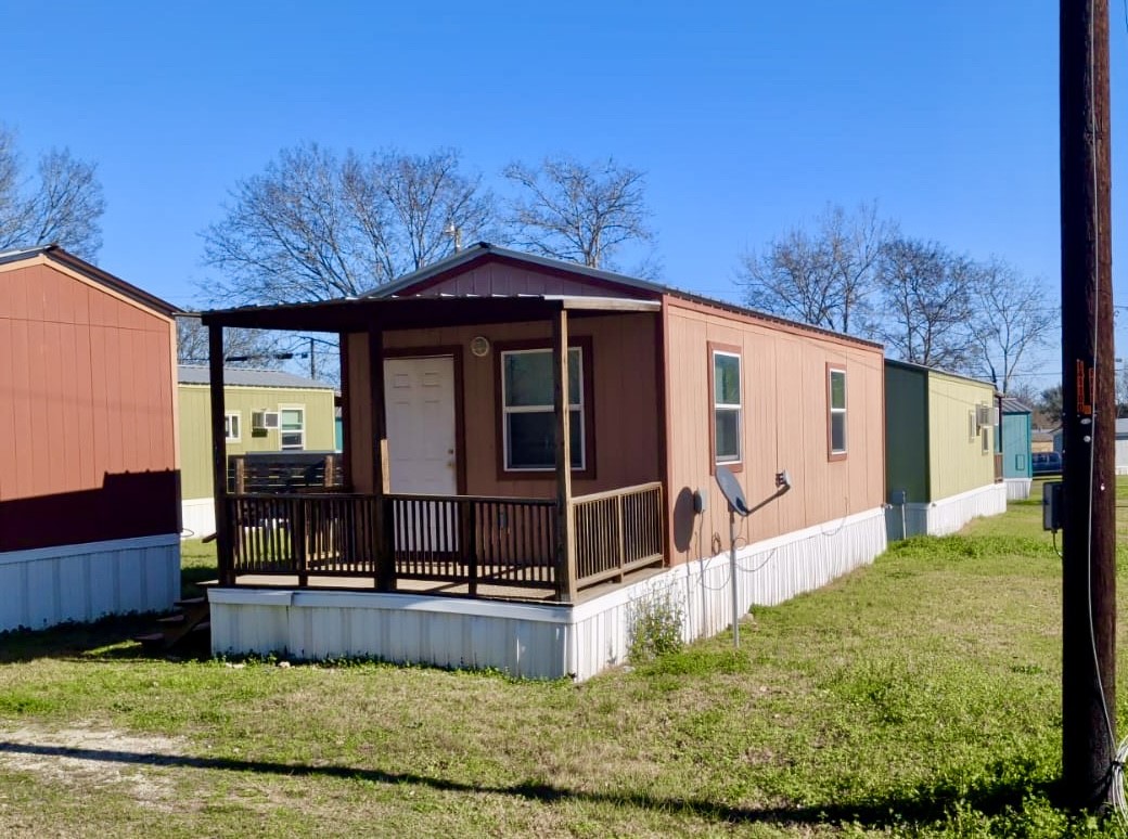 401 North Clegg Street Trinity, TX 75862 - Photo 14 of 15 a view of a house with backyard and sitting area