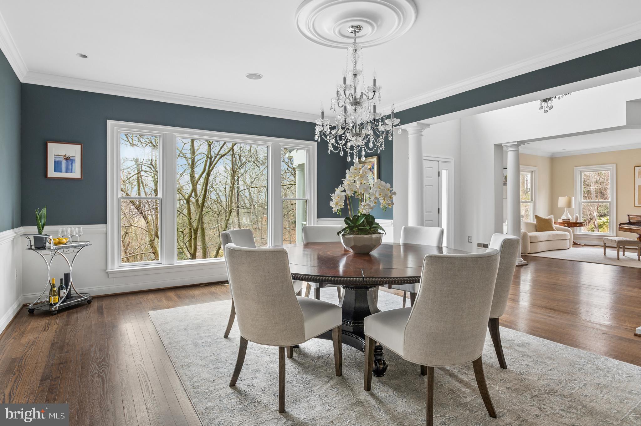 5400 Mohican Road Bethesda, MD 20816 - Photo 11 of 47 a view of a dining room with furniture window and wooden floor