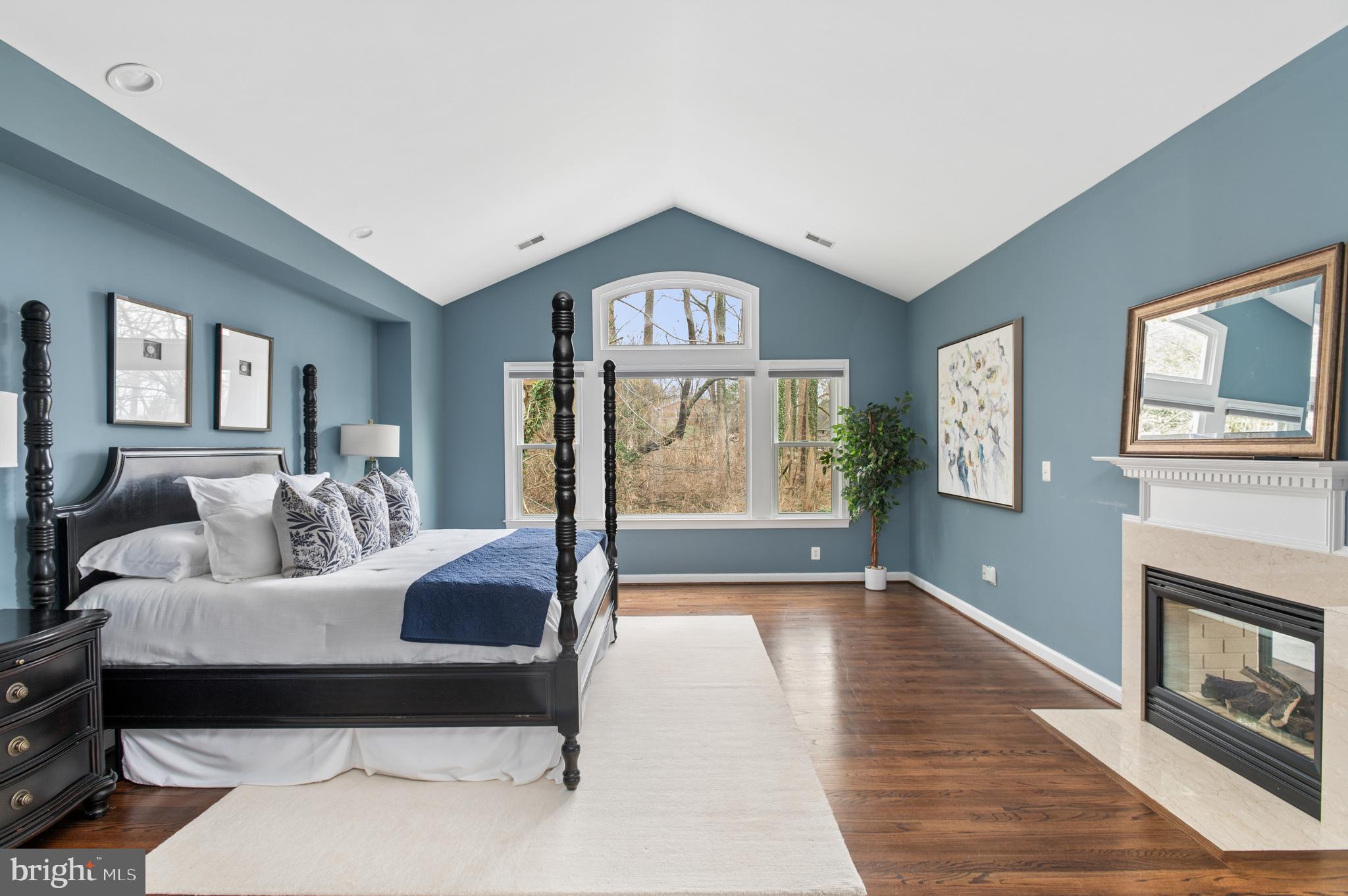 5400 Mohican Road Bethesda, MD 20816 - Photo 24 of 47 a spacious bedroom with a bed and glass walk in closet