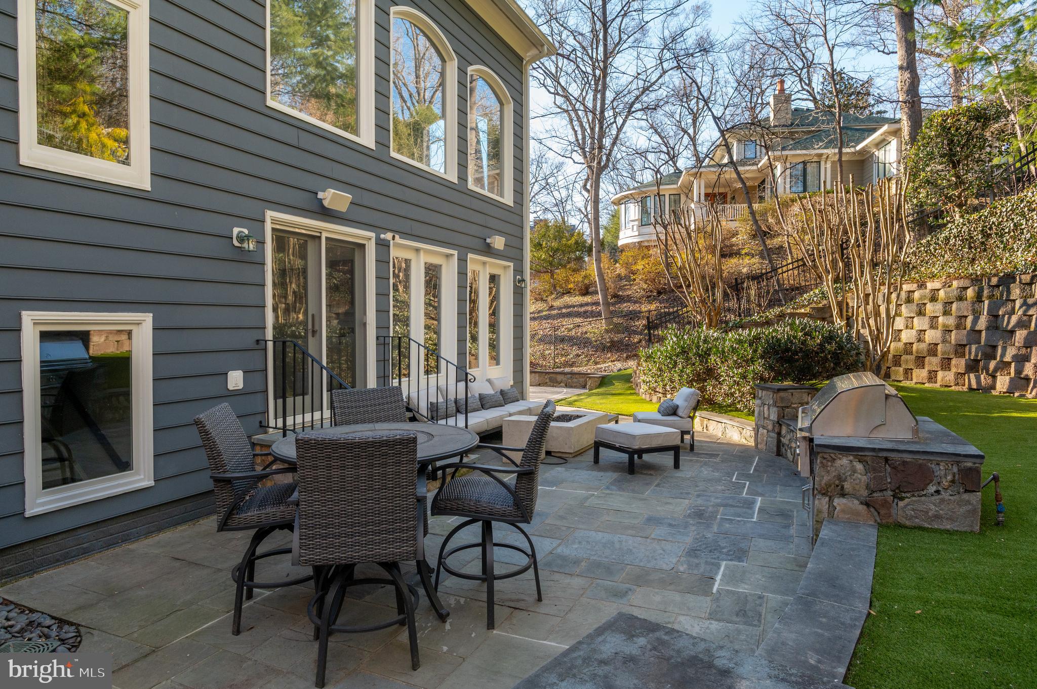 5400 Mohican Road Bethesda, MD 20816 - Photo 41 of 47 a view of a patio with couches table and chairs and potted plants