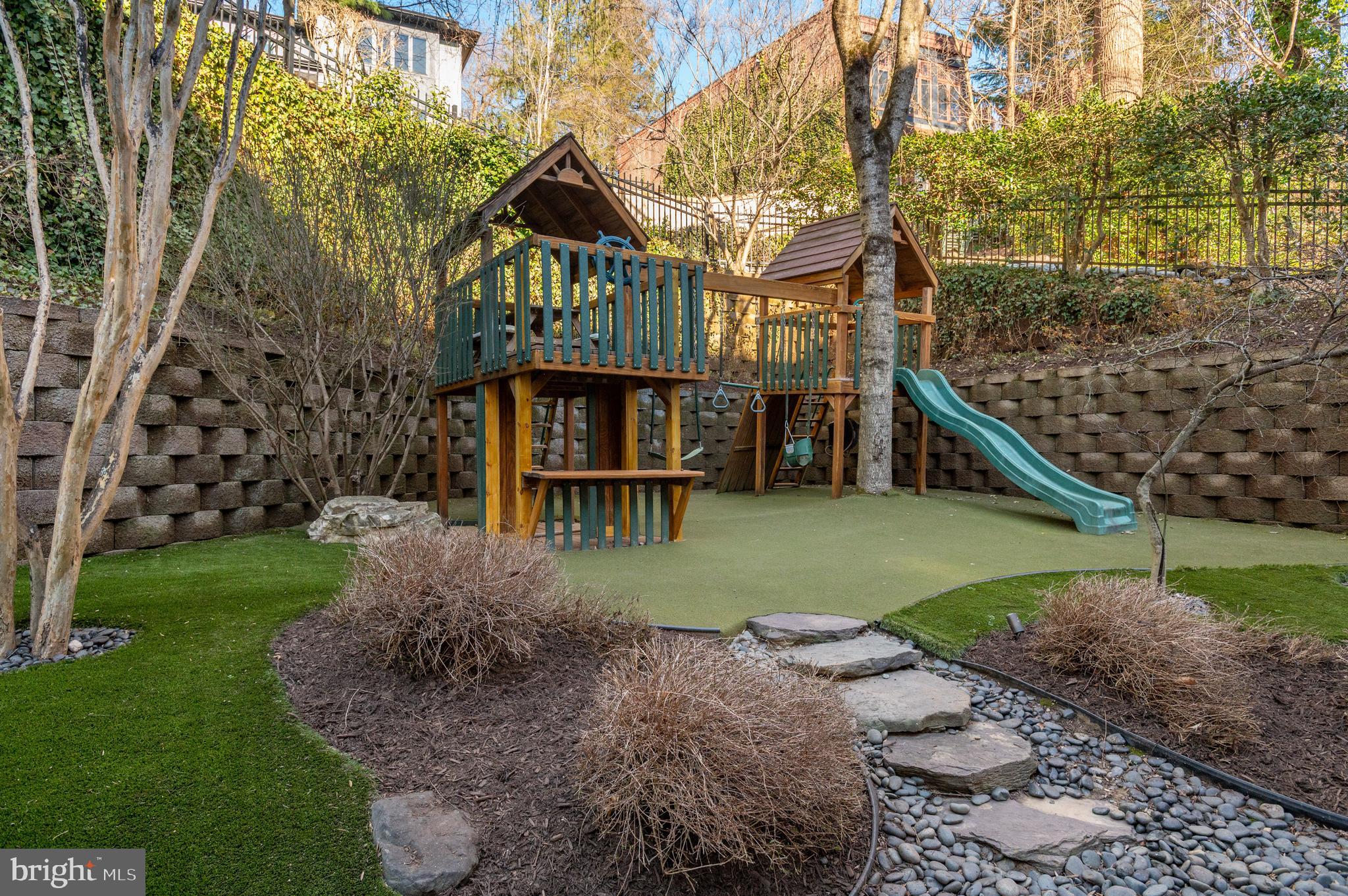 5400 Mohican Road Bethesda, MD 20816 - Photo 42 of 47 a front view of a house with a yard and outdoor seating