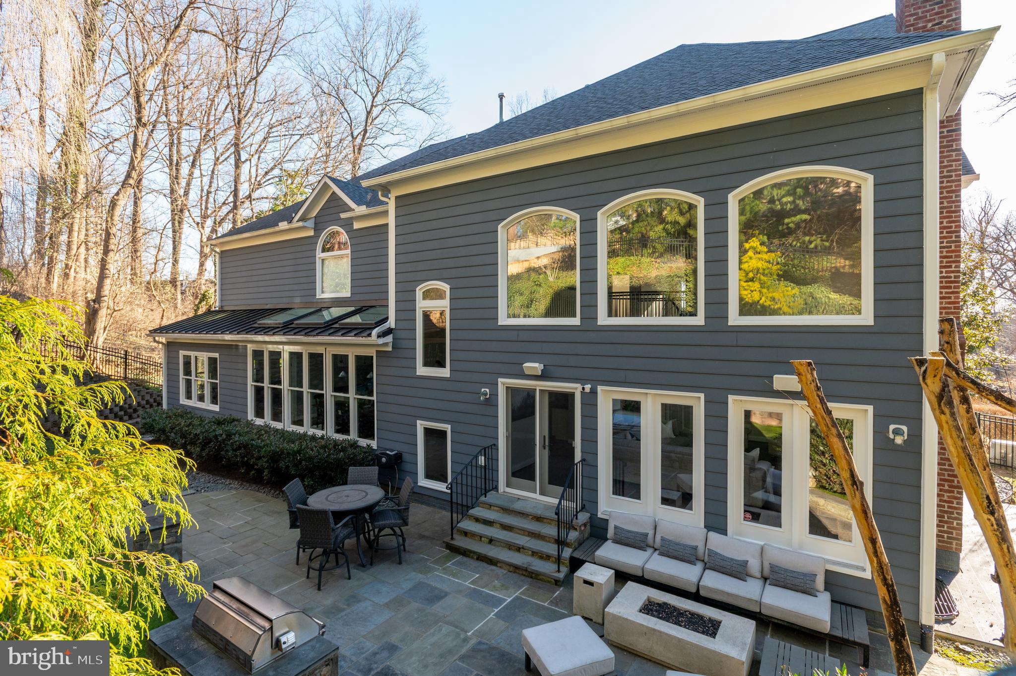 5400 Mohican Road Bethesda, MD 20816 - Photo 44 of 47 a front view of a house with glass windows and furniture