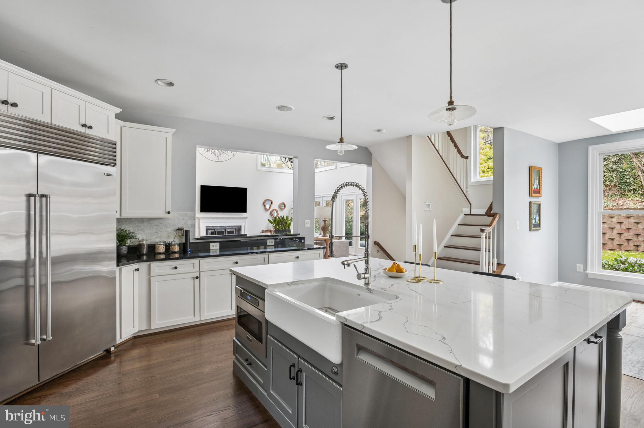 5400 Mohican Road Bethesda, MD 20816 - Photo 6 of 47 a kitchen with stainless steel appliances a sink a stove a refrigerator cabinets and a window