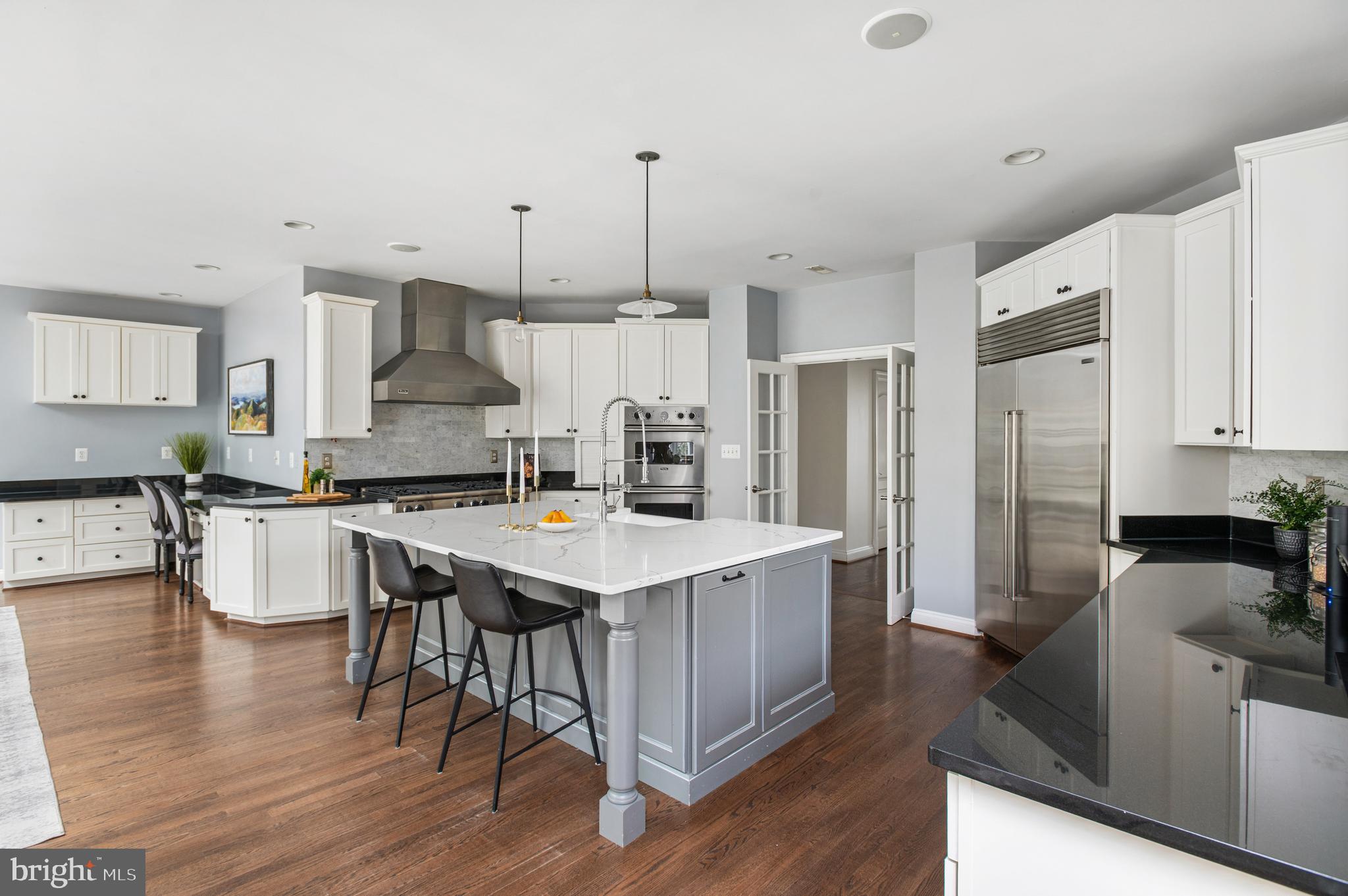 5400 Mohican Road Bethesda, MD 20816 - Photo 7 of 47 a kitchen that has a lot of counter space and wooden floor