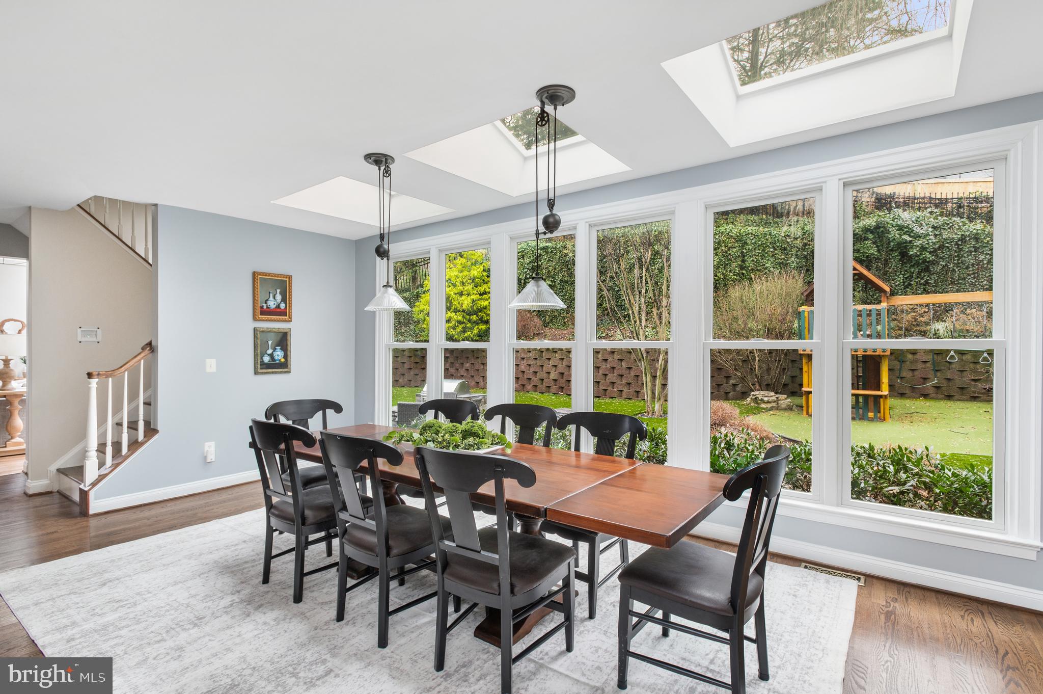 5400 Mohican Road Bethesda, MD 20816 - Photo 8 of 47 a view of a dining room with furniture window and wooden floor