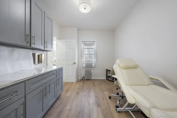 a room with a chair and wooden floor