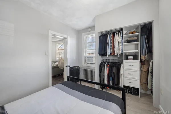 a bedroom with a bed and furniture