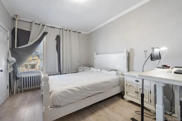 a bedroom with a bed and a table