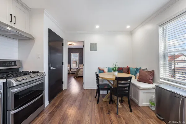 a kitchen with a table and chairs in it