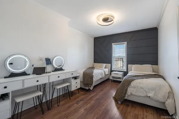 a bedroom with bed and a window