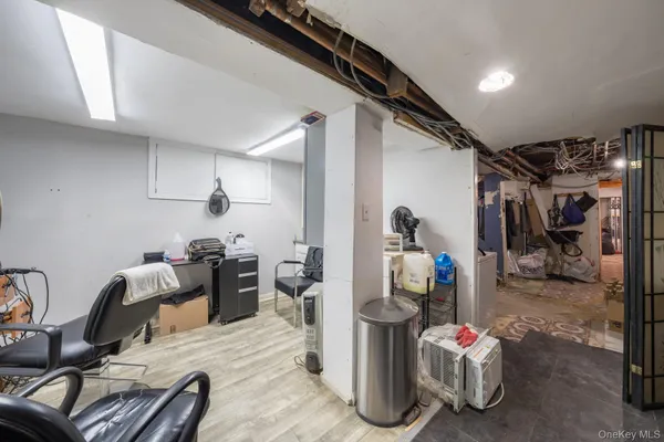 a bedroom with furniture and a gym equipment