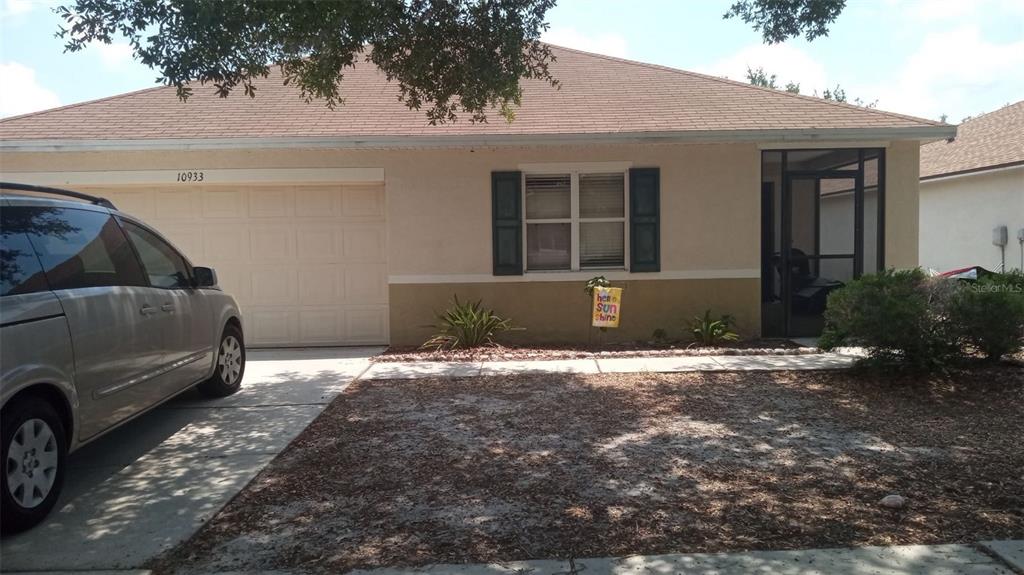 10933 Subtle Trail Drive Riverview, FL 33579 - Photo 1 of 22 a view of garage and yard