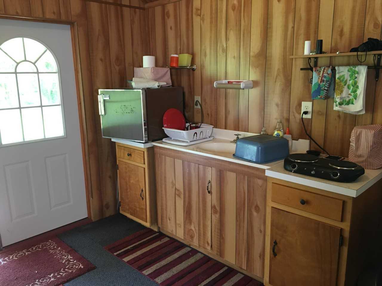 210 Chestnut Level Road Southeast Copper Hill, VA 24079 - Photo 5 of 15 a kitchen with a stove and cabinets