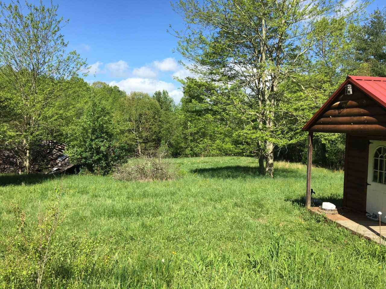 210 Chestnut Level Road Southeast Copper Hill, VA 24079 - Photo 7 of 15 a backyard of a house with lots of green space