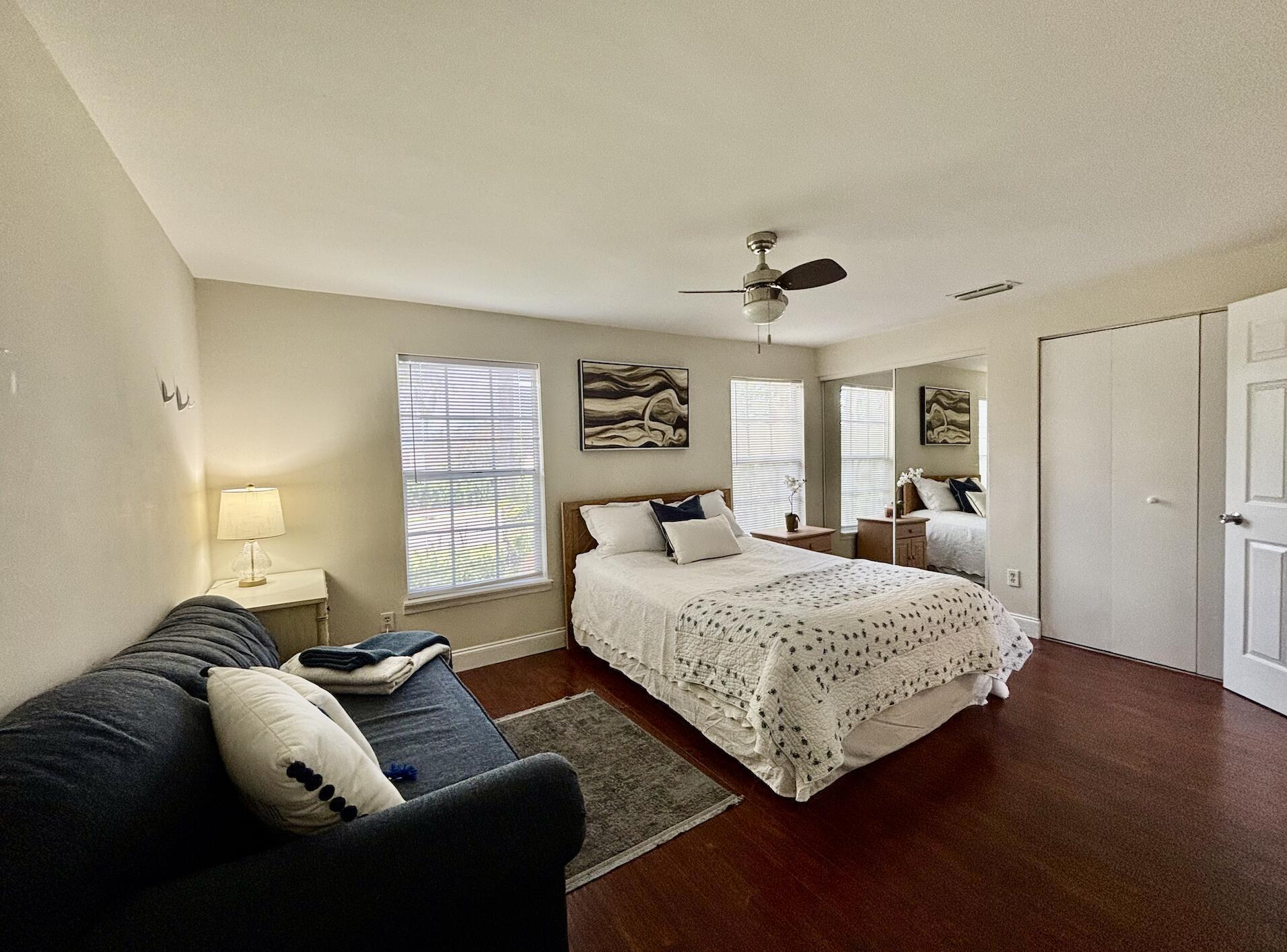13472 Old Englishtown Road Wellington, FL 33414 - Photo 11 of 18 a bedroom with a bed couch and window
