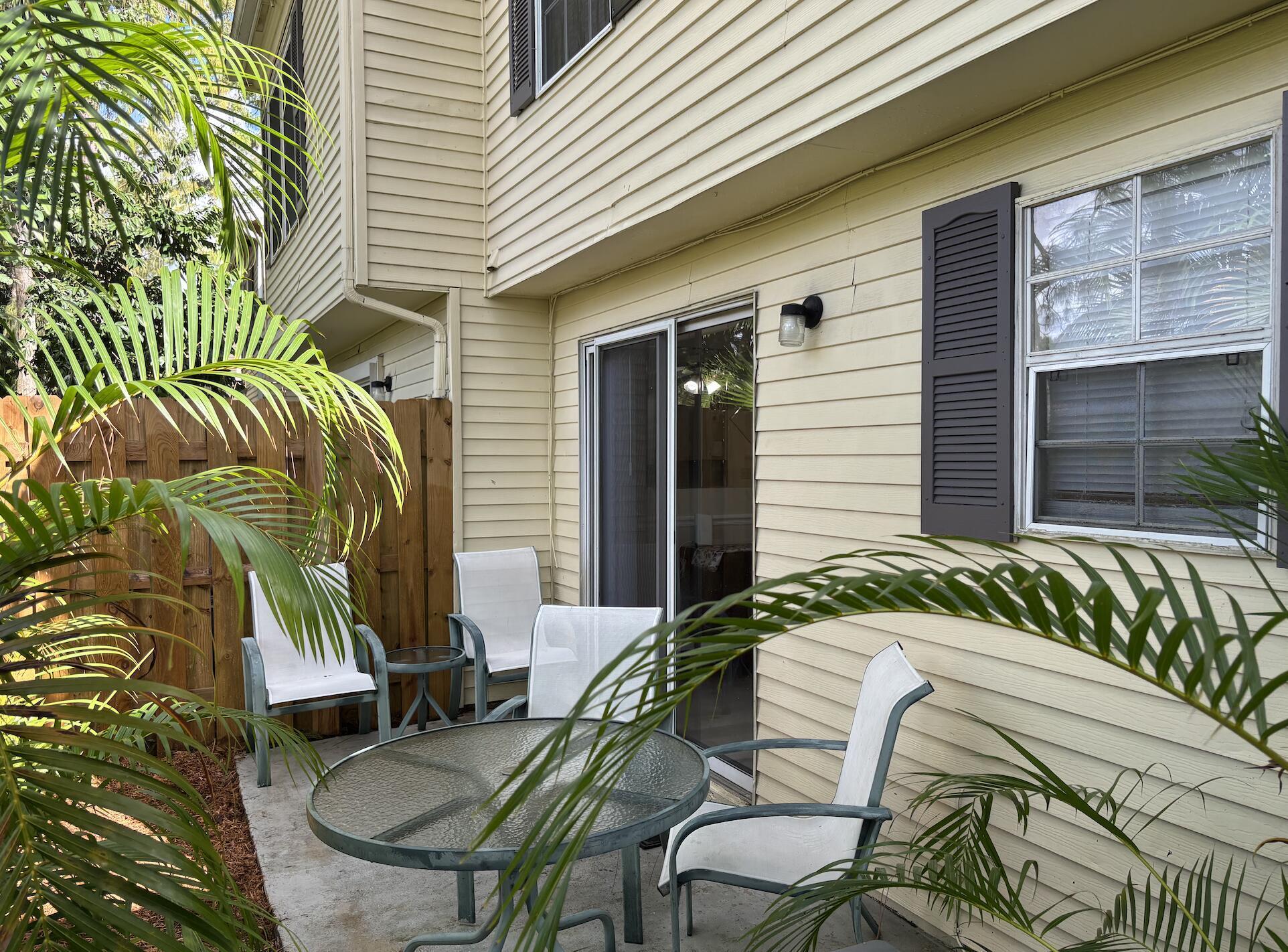 13472 Old Englishtown Road Wellington, FL 33414 - Photo 17 of 18 a view of two chairs in patio