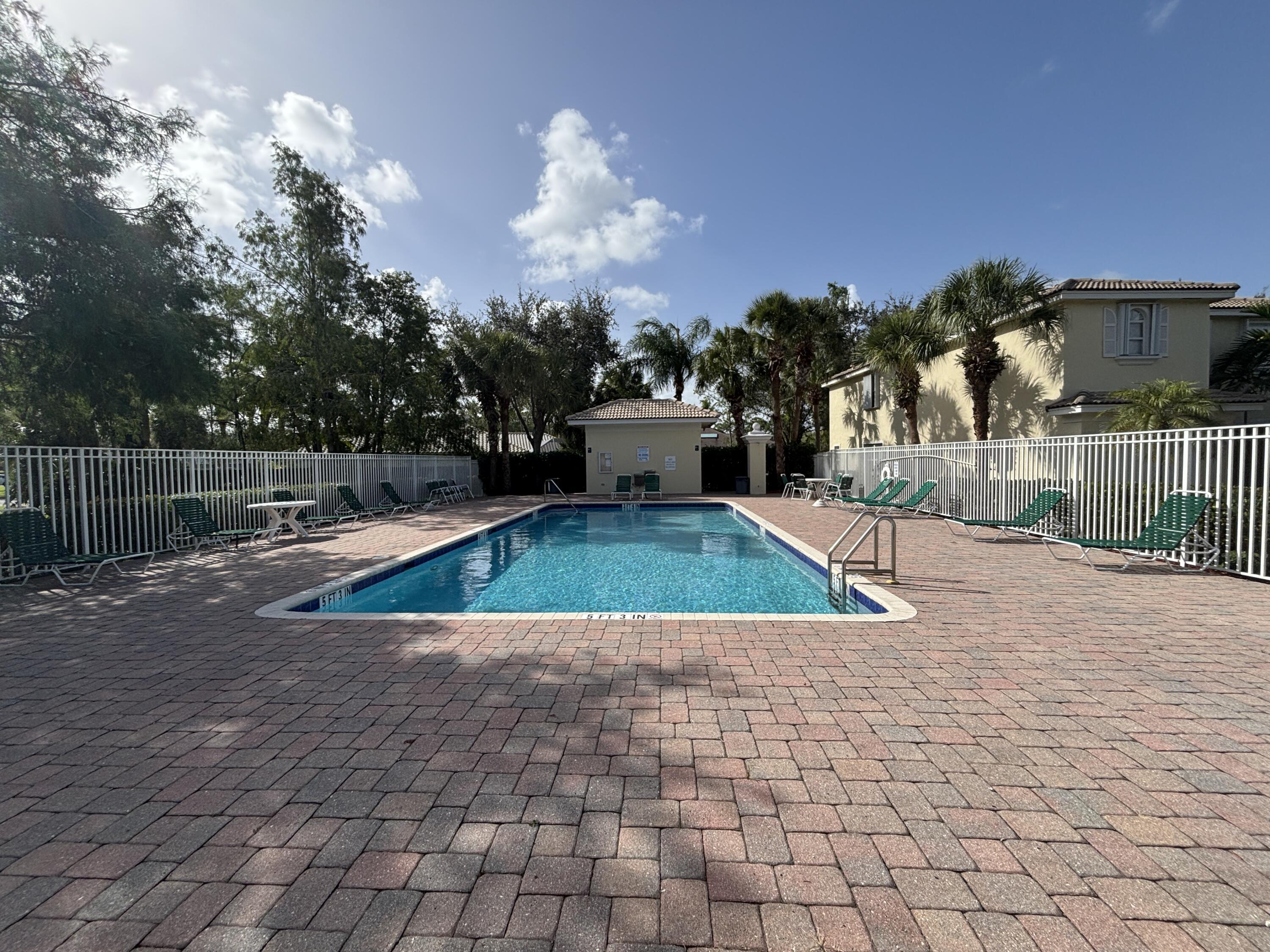 13472 Old Englishtown Road Wellington, FL 33414 - Photo 18 of 18 a view of a swimming pool with a yard