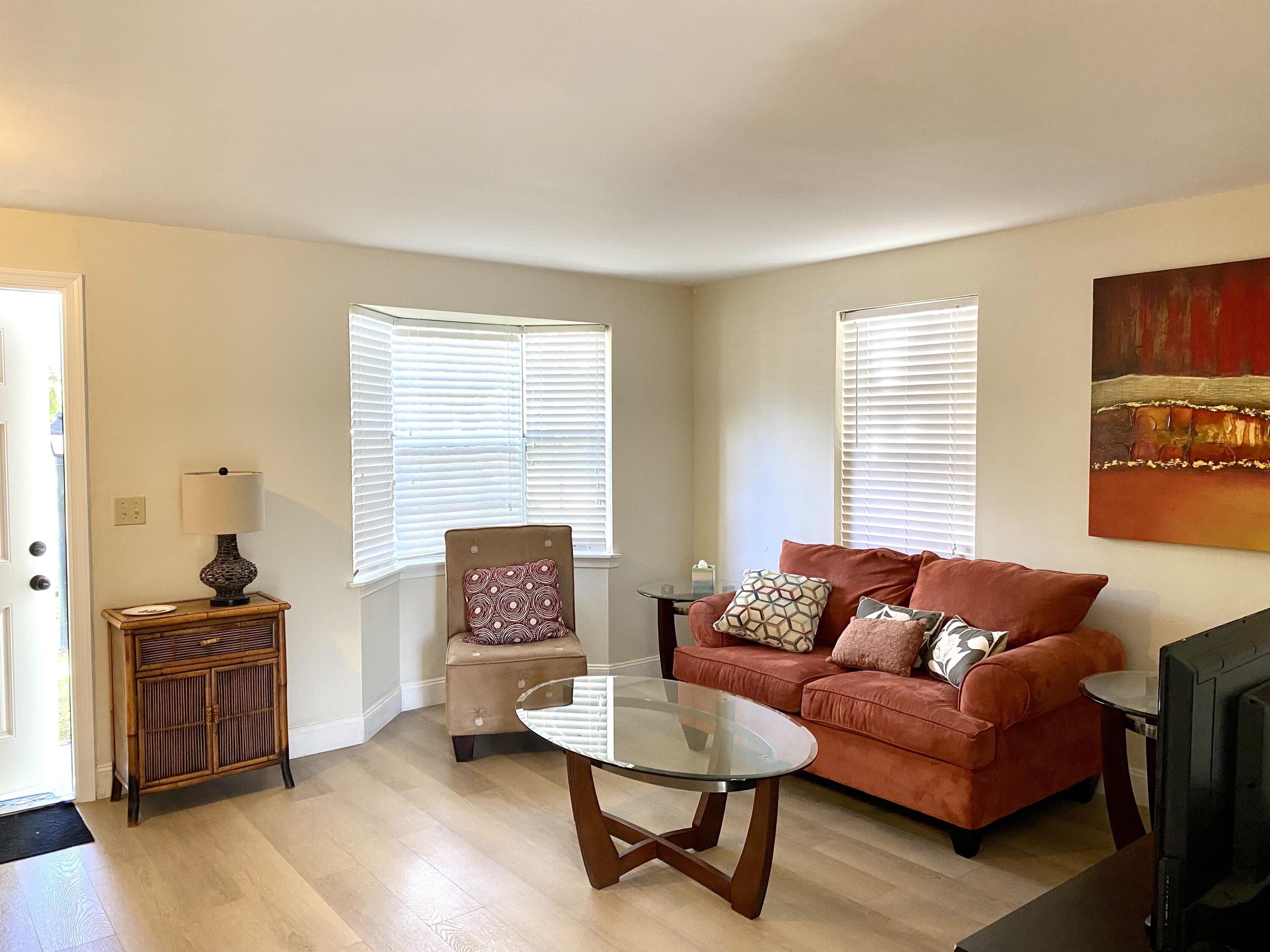 13472 Old Englishtown Road Wellington, FL 33414 - Photo 5 of 18 a living room with furniture and a window